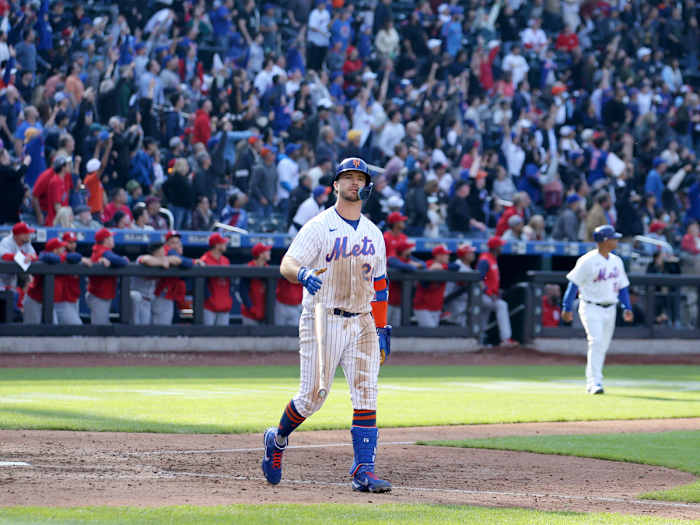 May 19, 2022; New York City, New York, USA; New York Mets first baseman Pete Alonso (20) flips his bat after hitting a walkoff two run home run against the St. Louis Cardinals in the tenth inning at Citi Field.