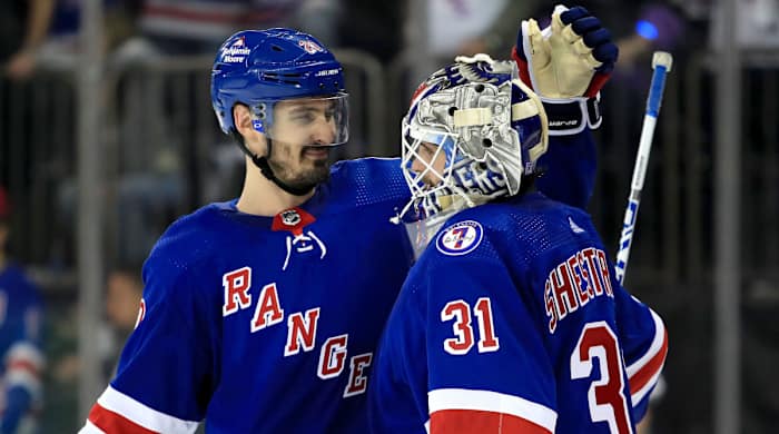 New York Rangers left wing Chris Kreider (20) celebrates a 3-1 win against the Carolina Hurricanes with New York Rangers goalie Igor Shesterkin (31) in game three of the second round