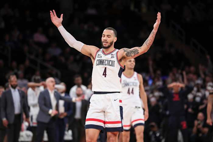 Connecticut Huskies guard Tyrese Martin (4) waves to the crowd in the second half against the Seton Hall Pirates at the Big East Tournament at Madison Square Garden.