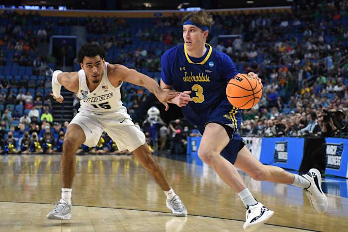 South Dakota State Jackrabbits guard Baylor Scheierman (3) drives against Providence Friars forward Justin Minaya (15) in the first half during the first round of the 2022 NCAA Tournament at KeyBank Center.