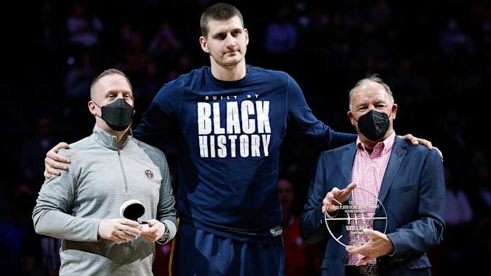 Denver Nuggets center Nikola Jokic (C) is presented with an NBA All-Star ring from Nuggets president Tim Connelly.