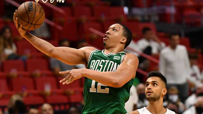 Boston Celtics forward Grant Williams (12) drives to the basket against as Miami Heat center Omer Yurtseven.