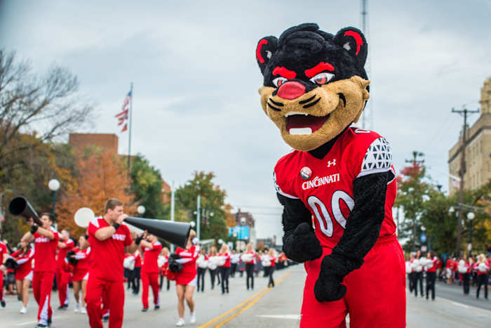 The Bearcat mascot pumps up the fans lined up along Clifton Avenue Saturday afternoon during the University of Cincinnati Homecoming Parade October 24, 2015. 102415 Uc Homecoming 01