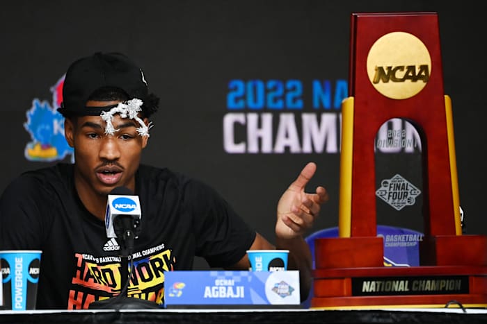 Kansas Jayhawks guard Ochai Agbaji (30) speaks during a press conference after defeating the North Carolina Tar Heels in the 2022 NCAA men's basketball tournament Final Four championship game at Caesars Superdome.