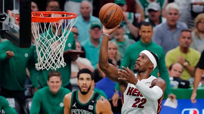 Heat’s Jimmy Butler shoots in front of Celtics’ Jayson Tatum.
