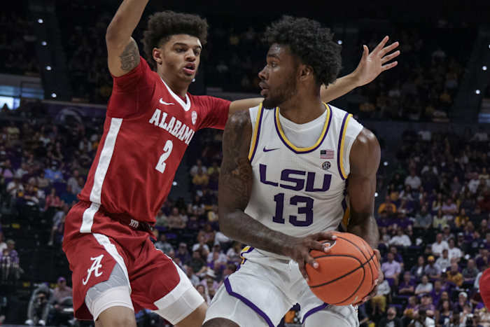 LSU Tigers forward Tari Eason (13) dribbles against Alabama Crimson Tide forward Darius Miles (2) during the first half at the Pete Maravich Assembly Center.