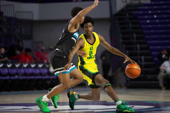 AZ Compass Prep's Chance Westry (2) dribbles against Combine Academy's Preston Murphy, Jr. (3) during the second half of the 48th annual City of Palms Classic Signature Series championship between AZ Compass Prep and Combine Academy, Tuesday, Dec. 21, 2021, at Suncoast Credit Union Arena in Fort Myers, Fla.AZ Compass Prep defeated Combine Academy 58-43. City of Palms Classic 2021: AZ Compass Prep vs. Combine Academy, Signature Series championship