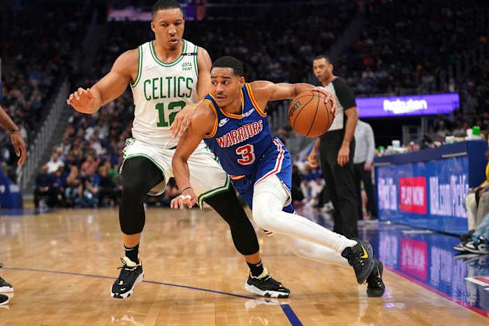 Mar 16, 2022; San Francisco, California, USA; Golden State Warriors guard Jordan Poole (3) dribbles past Boston Celtics forward Grant Williams (12) in the second quarter at the Chase Center. Mandatory Credit: Cary Edmondson-USA TODAY Sports