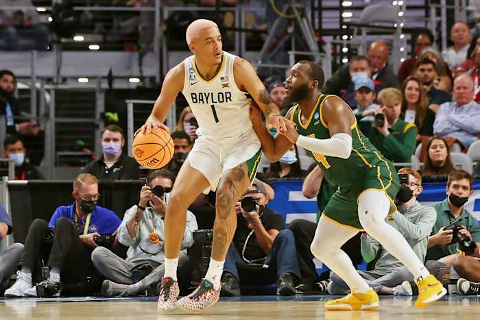 Baylor Bears forward Jeremy Sochan (1) dribbles the ball against Norfolk State Spartans guard Joe Bryant Jr. (4) during the second half during the first round of the 2022 NCAA Tournament at Dickies Arena.