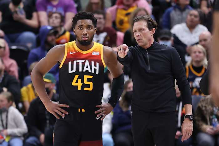 Utah Jazz guard Donovan Mitchell stands next to coach Quin Snyder.