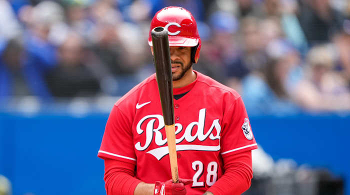 Reds left fielder Tommy Pham (29) bats against the Blue Jays.