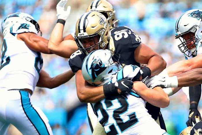Saints DE Payton Turner (98) tackles Panthers RB Christian McCaffrey (22). Credit: crescentcitysports.com