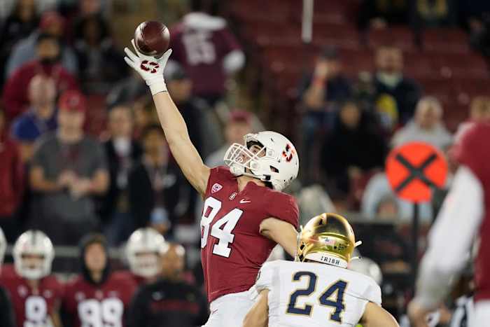 Stanford Cardinal tight end Benjamin Yurosek (84) catches a pass over Notre Dame Fighting Irish linebacker Jack Kiser (24) during the first quarter at Stanford Stadium.