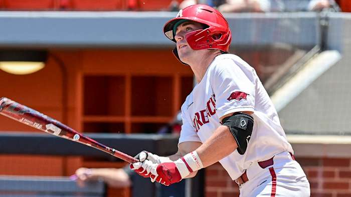 Arkansas' Cayden Wallace watches a home run fly over the left-field fence in the Razorbacks' 7-1 win over Grand Canyon in the first game of the NCAA Regional in Stillwater, Okla.