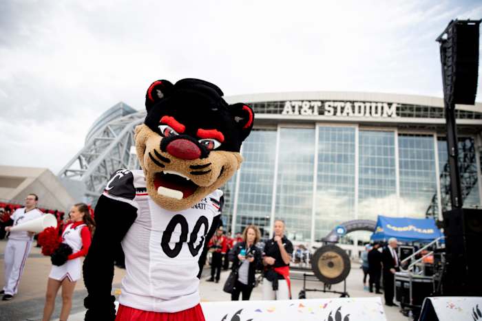 Cincinnati Bearcats mascot stands during the Cotton Bowl's Battle of the Bands outside AT&T Stadium in Arlington, Texas, on Thursday, Dec. 30, 2021. Cotton Bowl S Battle Of The Bands Ac 346