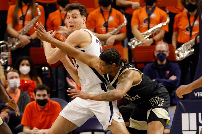 Virginia Cavaliers center Francisco Caffaro (22) steals the ball from Wake Forest Demon Deacons guard Alondes Williams (31) during the second half at John Paul Jones Arena.