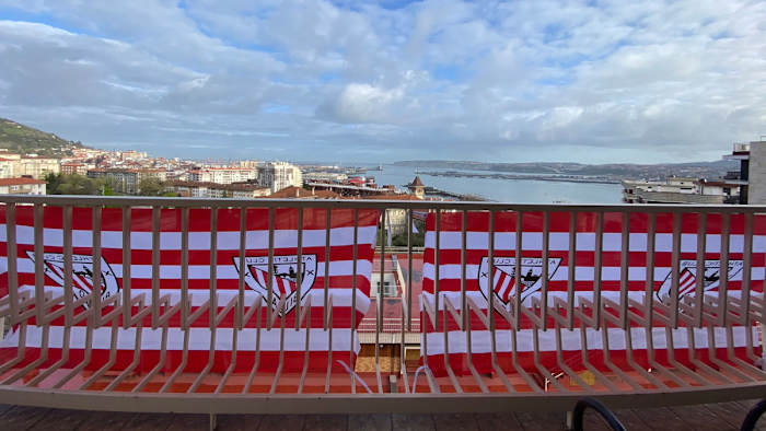 Athletic Bilbao banners hang on city balconies in anticipation of two Copa del Rey finals