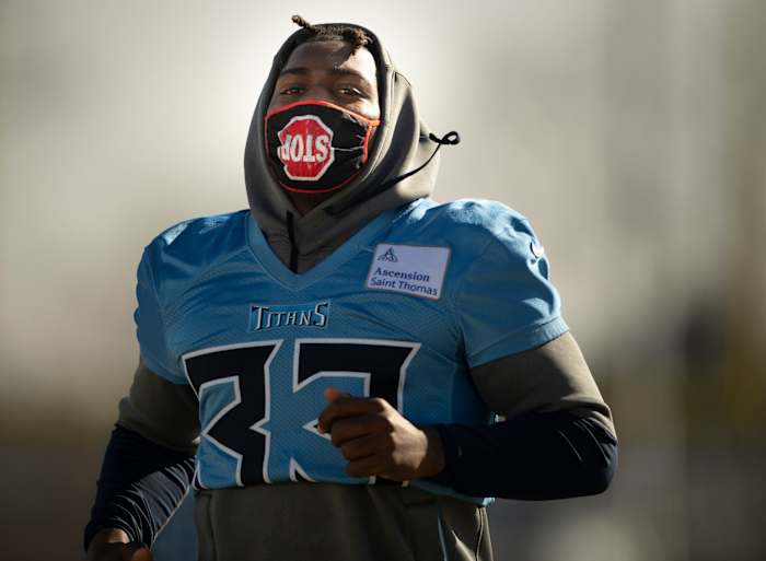 King jogs across the field during practice.