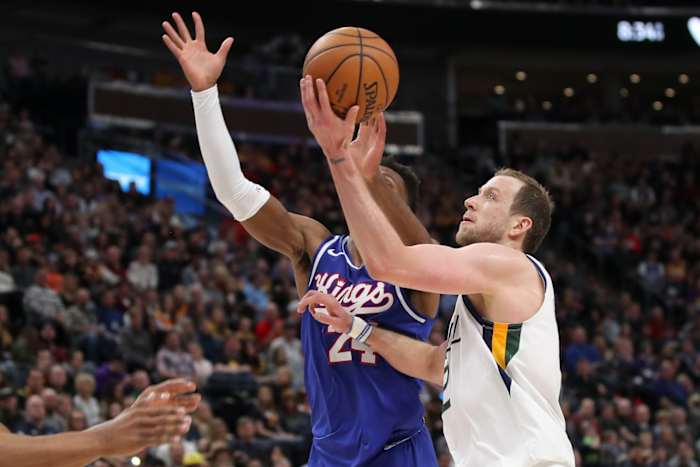 Joe Ingles (2) scores over Buddy Hield (24)