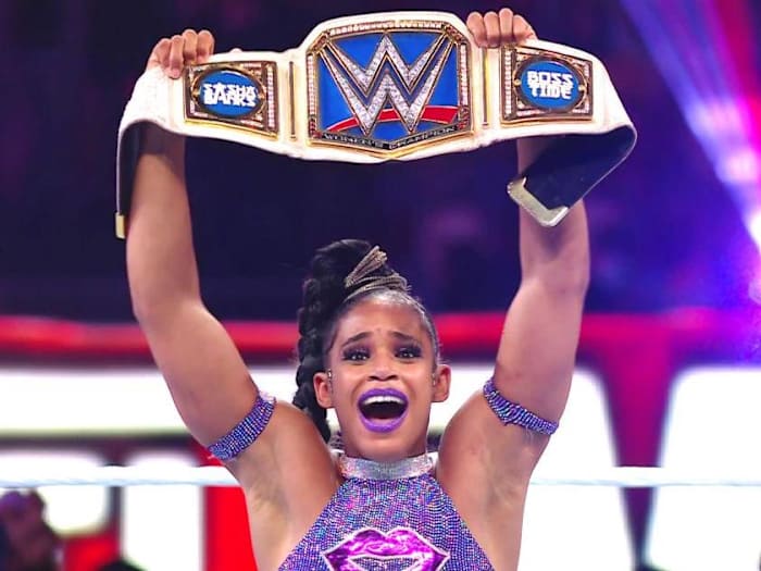 Bianca Belair holds up belt at WrestleMania 37