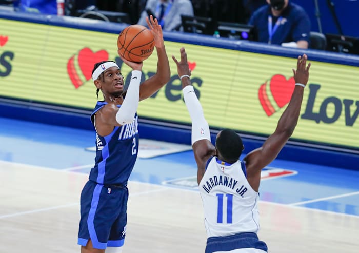 Oklahoma City's Shai Gilgeous-Alexander shoots a 3-pointer over Mavericks guard Tim Hardaway Jr.