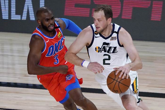 Joe Ingles (2) drives past Chris Paul (3) in a game against the Oklahoma City Thunder