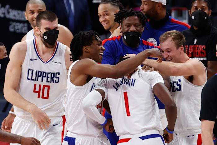 Apr 14, 2021; Detroit, Michigan, USA; LA Clippers guard Reggie Jackson (1) is congratulated by teammates after the game against the Detroit Pistons at Little Caesars Arena. Mandatory Credit: Rick Osentoski-USA TODAY Sports