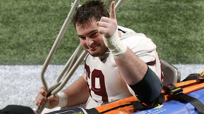 landon-dickerson-alabama-center-injured-crutches