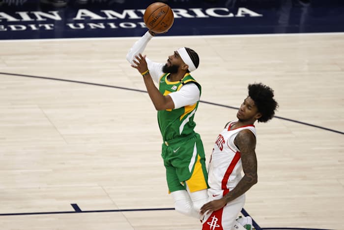 Mike Conley (10) draws the 'and-one' as he scores against the Houston Rockets