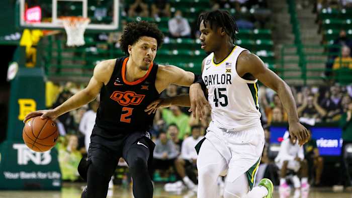 Cade Cunningham dribbles against Davion Mitchell