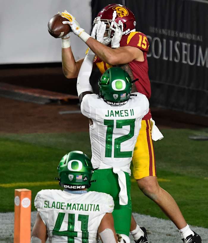 DJ James (12) breaks up a pass intended for wide receiver Drake London (15) against the USC Trojans in the 2020 Pac-12 Championship Game.