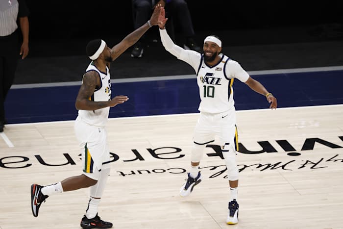 Mike Conley (10) and Royce O'Neale (23) celebrate