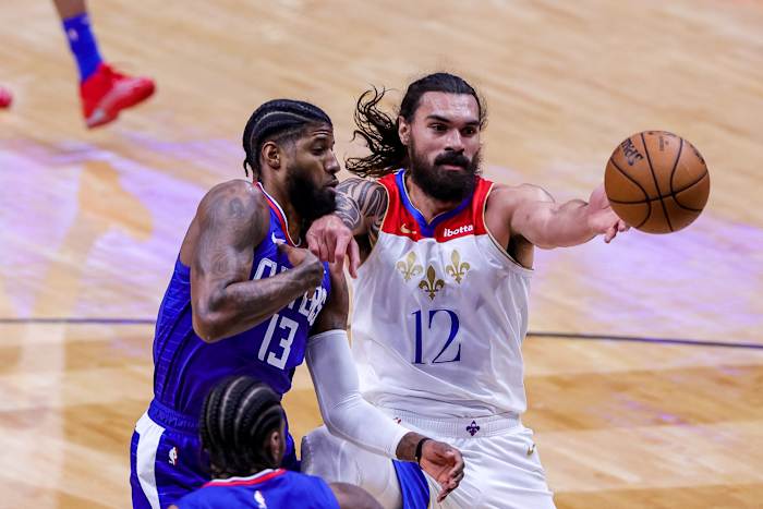 Mar 14, 2021; New Orleans, Louisiana, USA; New Orleans Pelicans center Steven Adams (12) blocks LA Clippers guard Paul George (13) from getting a rebound during the first half at the Smoothie King Center. Mandatory Credit: Stephen Lew-USA TODAY Sports