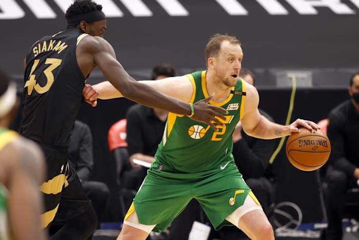 Joe Ingles (2) drives past Pascal Siakam (43) in a game against the Toronto Raptors