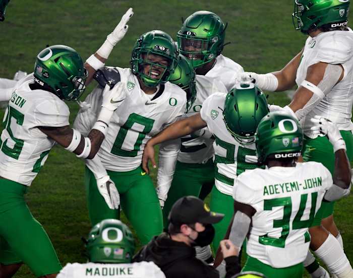 Oregon cornerback Deommodore Lenoir celebrates a first quarter interception against USC in the 2020 Pac-12 Championship Game in Los Angeles, California on December 18, 2020.
