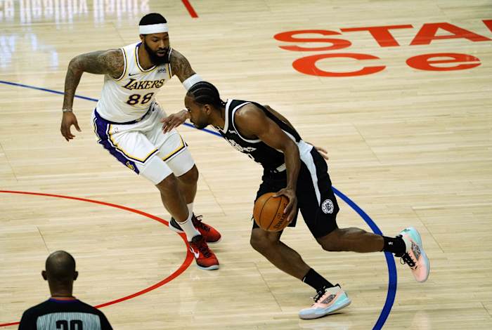 Apr 4, 2021; Los Angeles, California, USA; Los Angeles Lakers center Andre Drummond (2) moves the ball against Los Angeles Lakers forward Markieff Morris (88) during the first half at Staples Center. Mandatory Credit: Gary A. Vasquez-USA TODAY Sports