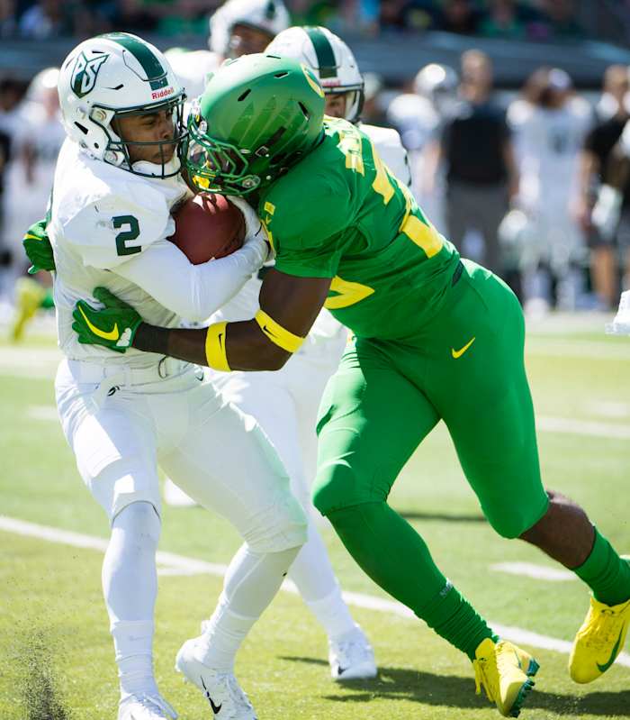 Adrian Jackson tackles wide receiver Antwone Williams in a game against Portland State in 2018.