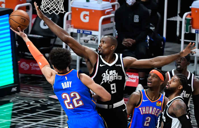 Jan 24, 2021; Los Angeles, California, USA; Oklahoma City Thunder forward Isaiah Roby (22) tries to score past LA Clippers center Serge Ibaka (9) dirge the third quarter at Staples Center. Mandatory Credit: Robert Hanashiro-USA TODAY Sports