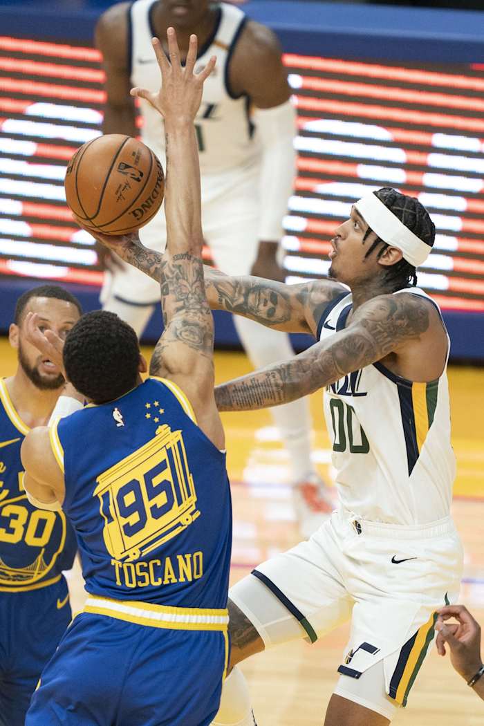 Jordan Clarkson (00) scores against the Golden State Warriors