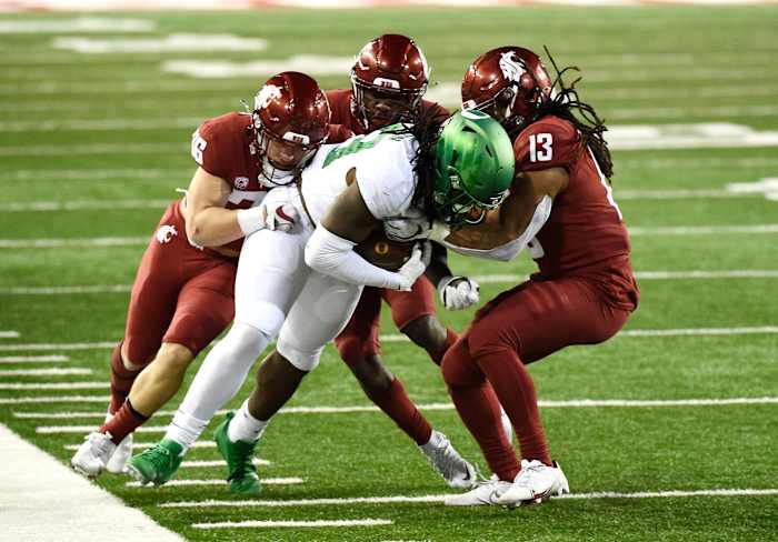 DJ Johnson carries defenders with him as he fights for yards after the catch in a game against the Washington State Cougars at Martin Stadium in Pullman, Washington on November 14, 2020.