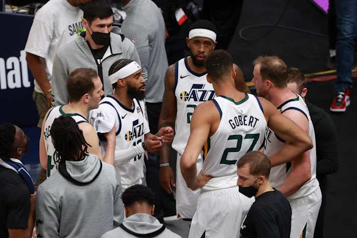 Jazz players talk during a timeout