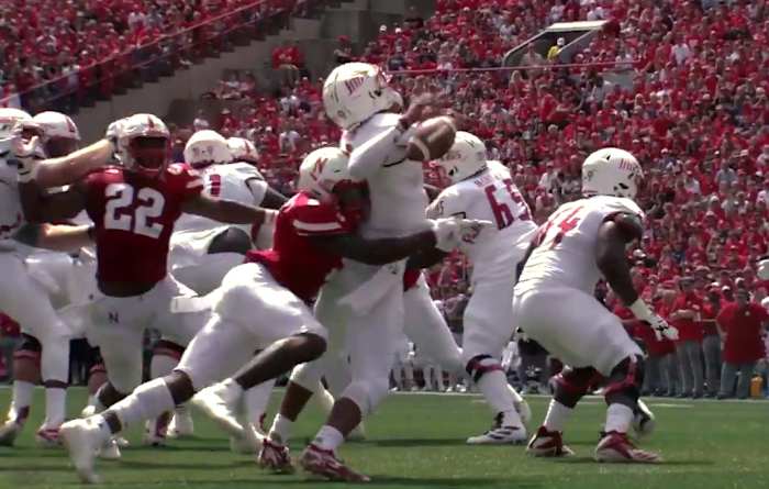 Nebraska's Cam Taylor-Britt forces a fumble by South Alabama QB Cephus Johnson. Alex Davis (22) recovered the ball in the end zone for a TD.