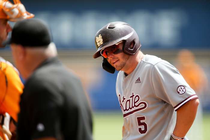 Mississippi State's Tanner Allen (5) takes an extra few minutes to recover after fouling a ball off his foot on Thursday. MSU went on to lose 12-2 to Tennessee as the Bulldogs were eliminated from the SEC Baseball Tournament. (Photo by Gary Cosby Jr.)