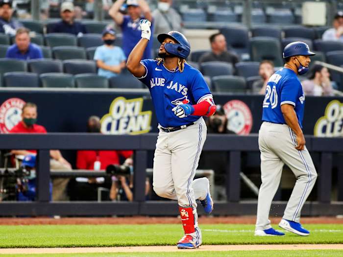 May 25, 2021; Bronx, New York, USA; Toronto Blue Jays first baseman Vladimir Guerrero Jr. (27) points to the sky after hitting a two run home in the third inning against the New York Yankees at Yankee Stadium.