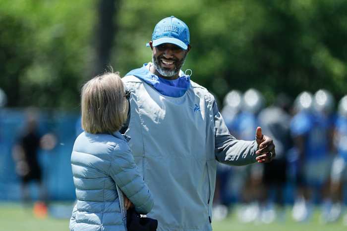 Detroit Lions general manager Brad Holmes speaks with principal owner Sheila Hamp.