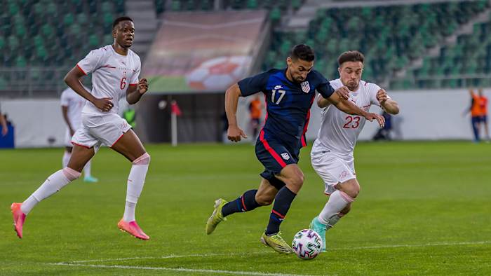 USA's Sebastian Lletget takes on Switzerland's Xherdan Shaqiri