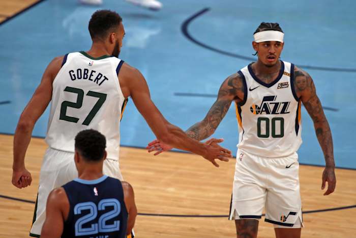 Rudy Gobert (27) and Jordan Clarkson (00) celebrate against the Memphis Grizzlies