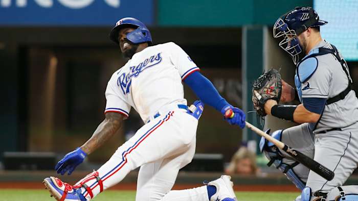 Jun 5, 2021; Arlington, Texas, USA; Texas Rangers center fielder Adolis Garcia (53) reacts after missing a pitch in the ninth inning against the Tampa Bay Rays at Globe Life Field.