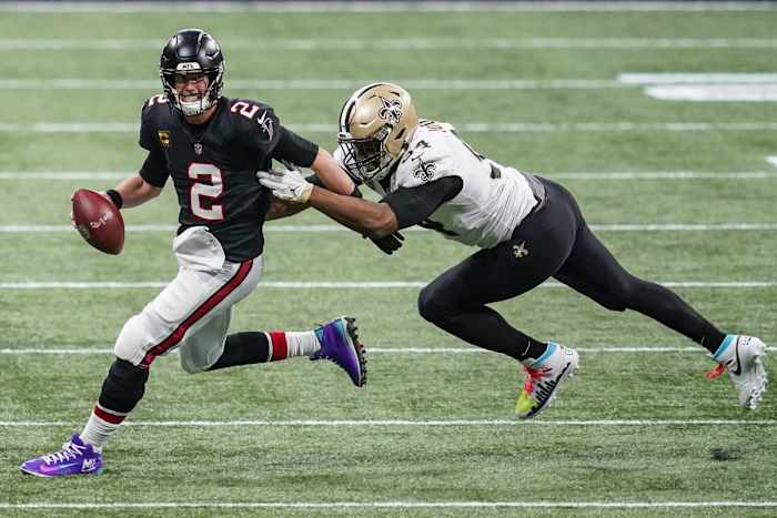 Atlanta quarterback Matt Ryan (2) runs to escape New Orleans Saints defensive end Cameron Jordan (94). Mandatory Credit: Dale Zanine-USA TODAY