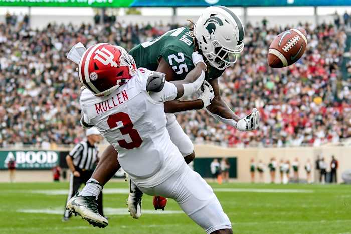 Michigan State's Darrell Stewart Jr., top, can't hold on to the ball as Indiana's Tiawan Mullen defends during the second quarter on Saturday, Sept. 28, 2019, in East Lansing.